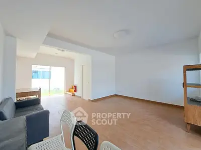 Spacious living room with modern minimalist design and natural light