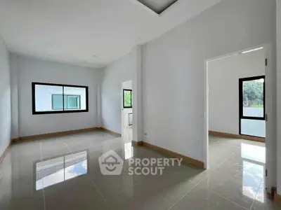 Spacious modern interior with large windows and glossy tiled floors, perfect for customization.