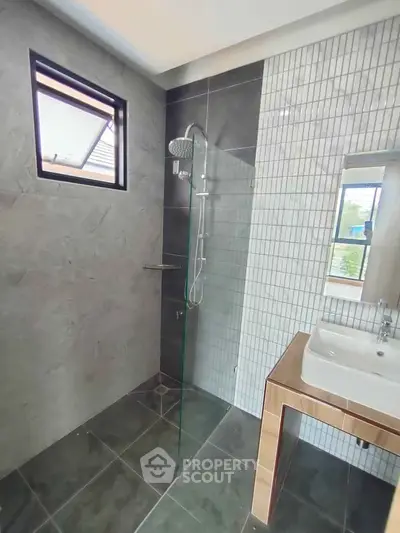 Modern bathroom with sleek shower and stylish sink design