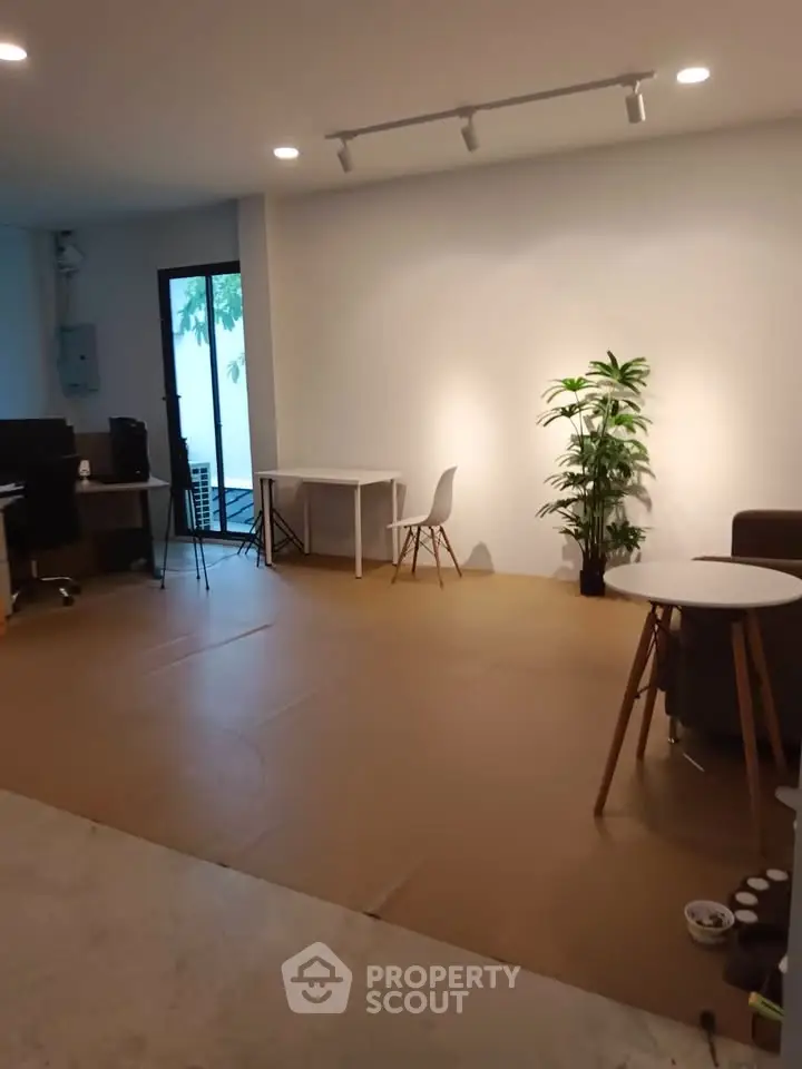 Spacious modern living room with minimalist decor and natural light