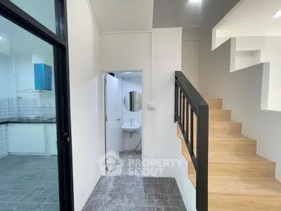 Modern interior with staircase and kitchen in open layout design