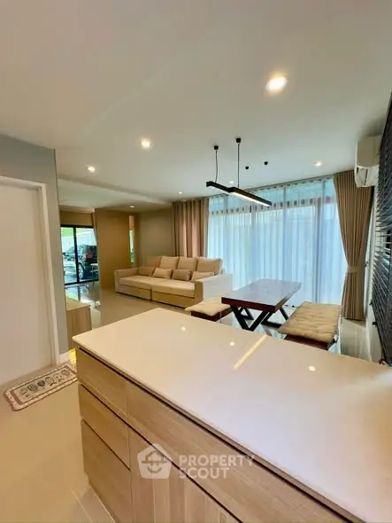 Spacious modern living room with open layout and elegant dining area