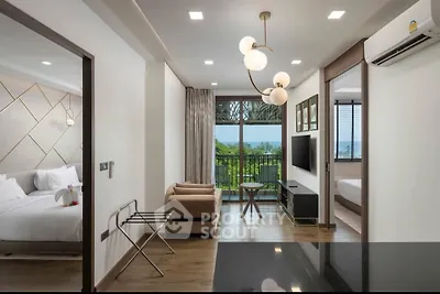 Modern living room with balcony and scenic view, featuring elegant decor and natural light.
