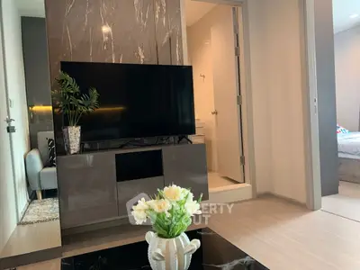 Modern living room with sleek TV setup and elegant decor