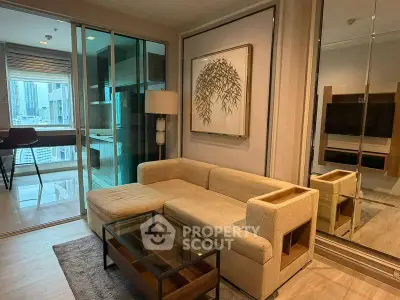 Modern living room with glass partition and city view, featuring a cozy beige sofa and stylish decor.