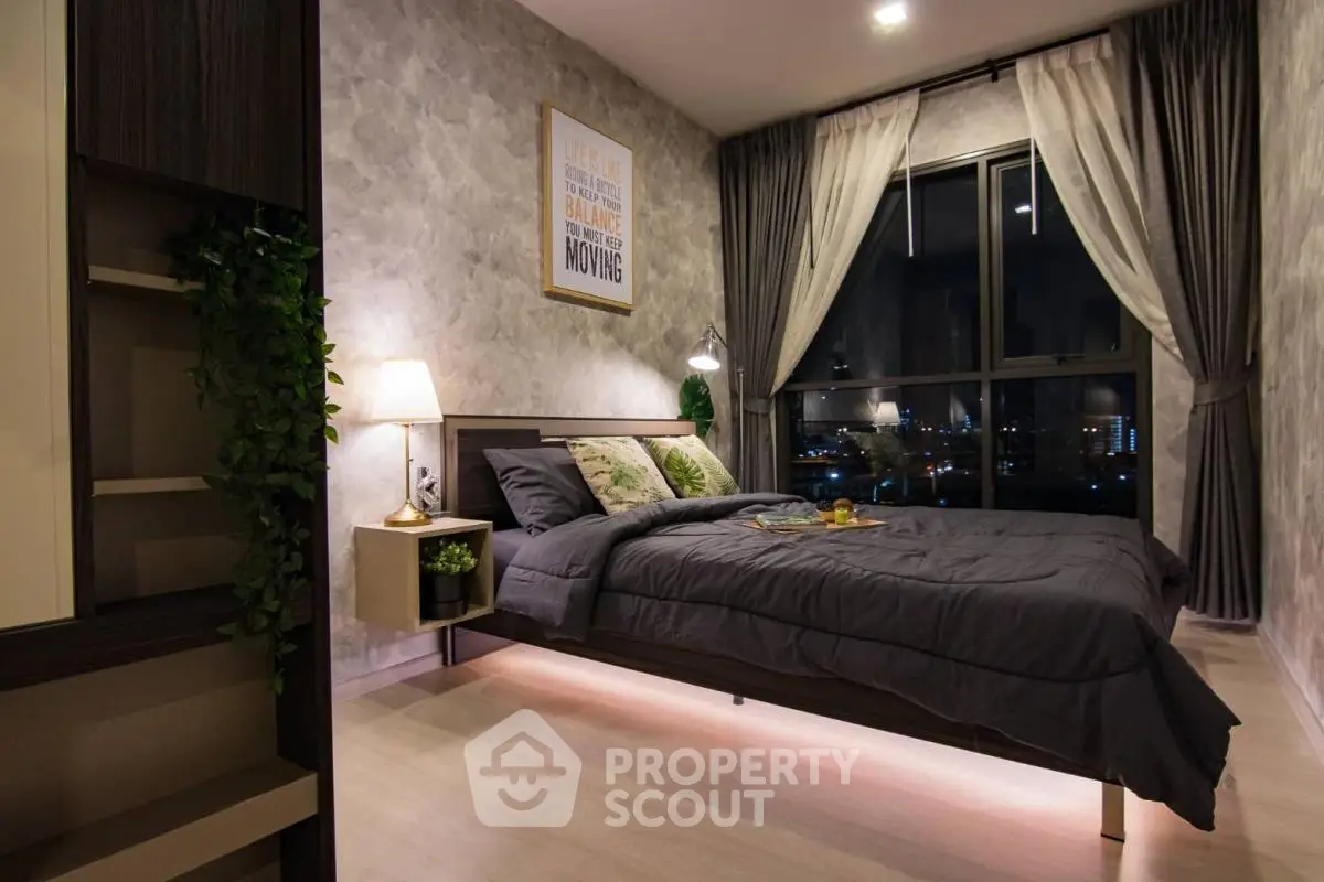 Luxurious bedroom with modern decor and city view, perfect for urban living.