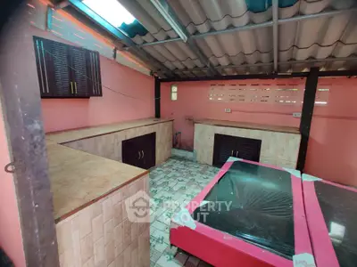 Unique outdoor kitchen area with tiled countertops and rustic charm.