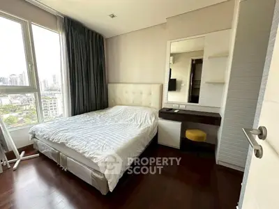 Spacious bedroom with city view, featuring a cozy bed and elegant decor, perfect for relaxation.