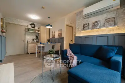 Modern living room with blue sofa and stylish decor in cozy apartment