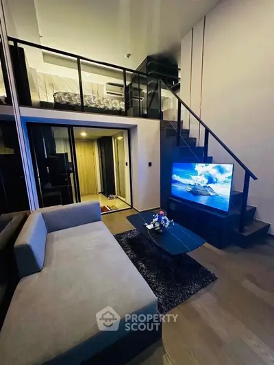 Modern loft-style living room with mezzanine bedroom and sleek interior design.