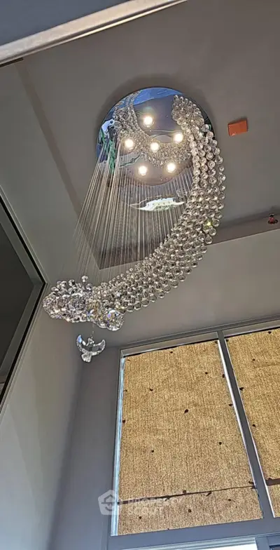 Elegant modern chandelier in a luxurious living room setting