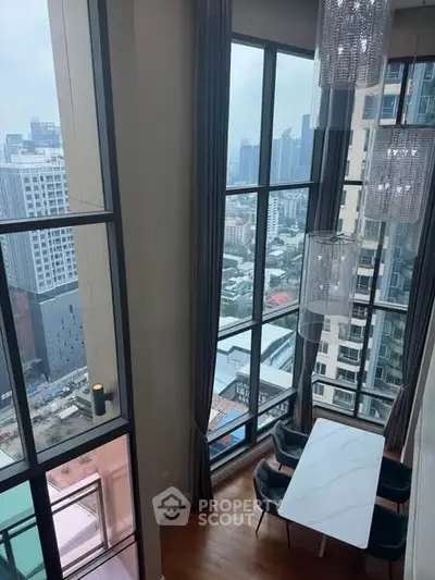 Stunning high-rise apartment with floor-to-ceiling windows and city view