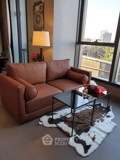 Stylish living room with cozy brown sofa and city view window
