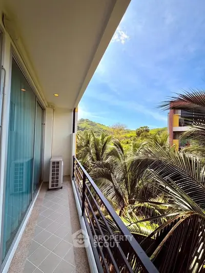 Stunning balcony view with lush greenery and modern architecture, perfect for relaxation and enjoying nature.
