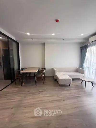 Spacious modern living room with sleek furniture and natural light