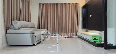 Modern living room with sleek sofa and glass coffee table