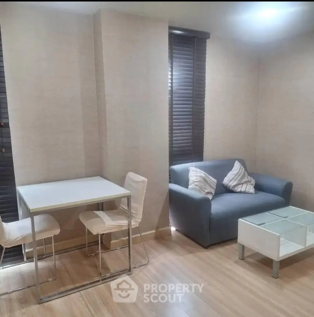 Cozy living room with modern furniture and natural light, perfect for relaxation and entertaining.