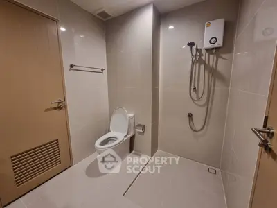Modern bathroom with sleek design and shower area in a real estate property.