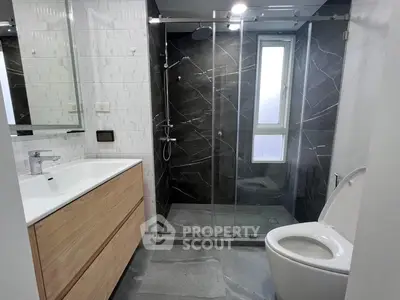 Modern bathroom with sleek shower and stylish vanity