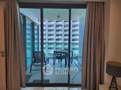 Modern apartment with balcony view of contemporary building architecture.