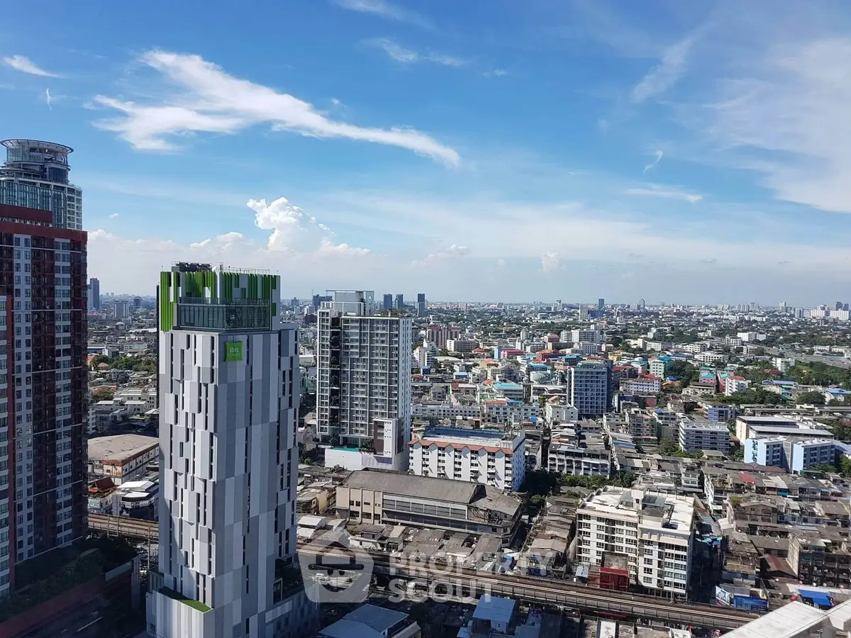 Stunning cityscape view from a high-rise building showcasing urban skyline and architecture.