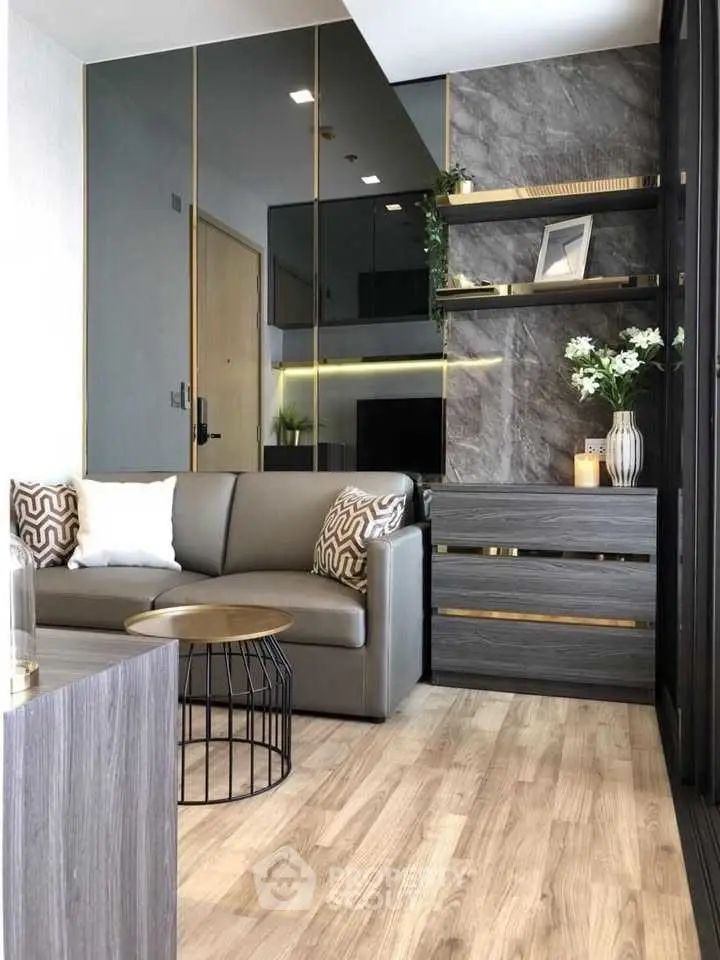 Modern living room with sleek design, featuring a comfortable sofa and stylish decor.