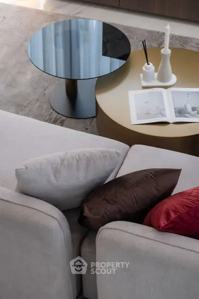 Stylish modern living room with elegant sofa and chic coffee tables