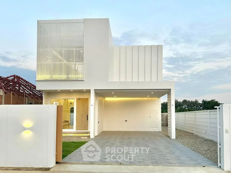 Modern minimalist two-story house with sleek facade and spacious driveway