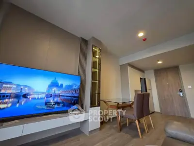 Modern living room with sleek furniture and large TV in stylish apartment