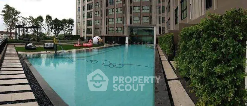 Luxurious condominium with stunning outdoor pool and lush greenery