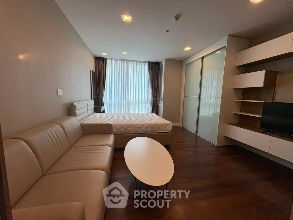 Modern bedroom with sleek furniture and natural light