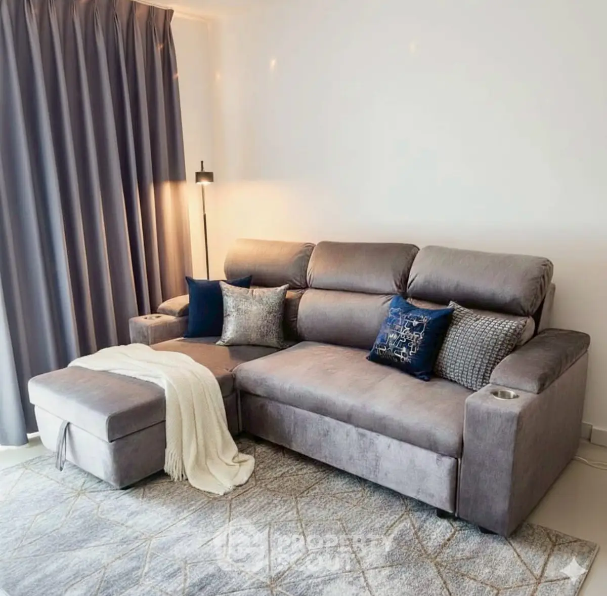 Stylish living room with plush gray sectional sofa and elegant decor