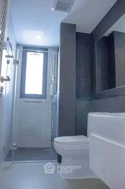 Modern bathroom with sleek design and glass shower enclosure