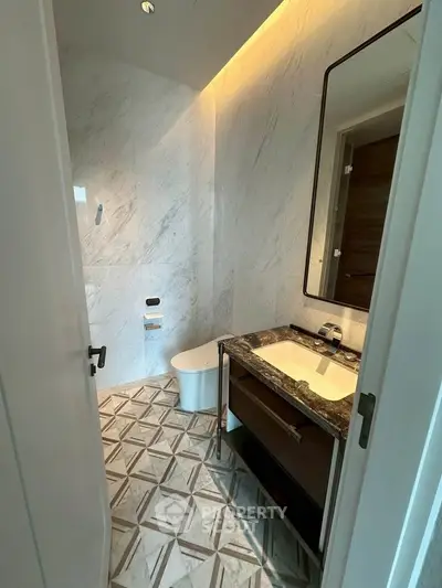 Luxurious modern bathroom with elegant marble walls and stylish vanity