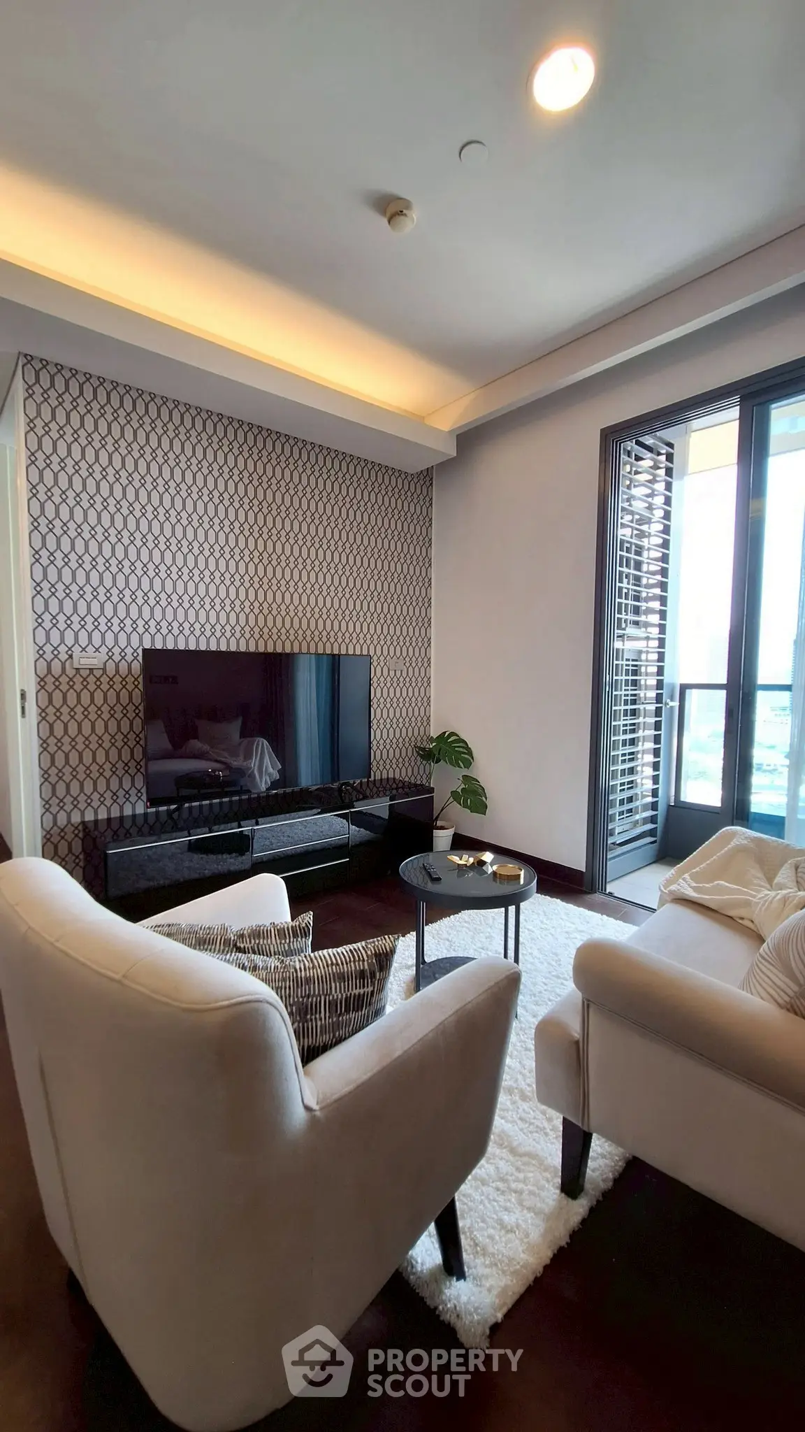 Stylish living room with modern decor and balcony view