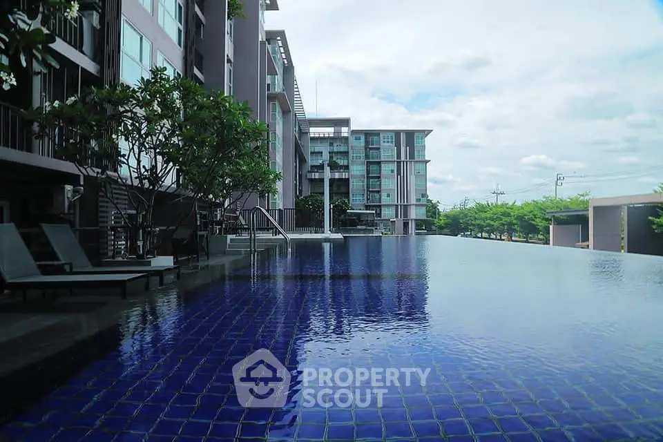 Luxurious condominium with stunning infinity pool and modern architecture.