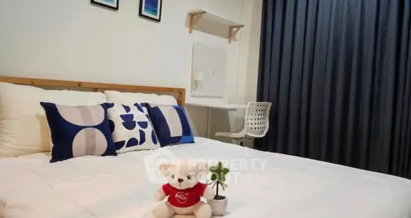 Cozy bedroom with modern decor and plush bedding, ideal for relaxation.