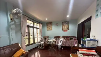 Cozy living room with wooden flooring and natural light