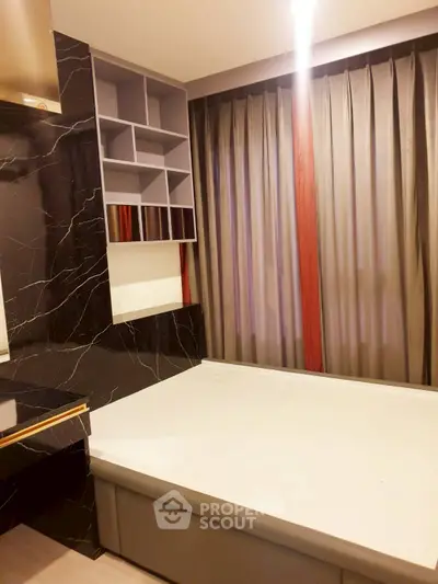 Modern bedroom with sleek marble accents and stylish shelving