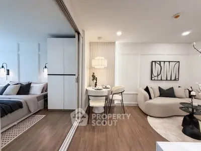 Modern open-plan living room with cozy seating and dining area