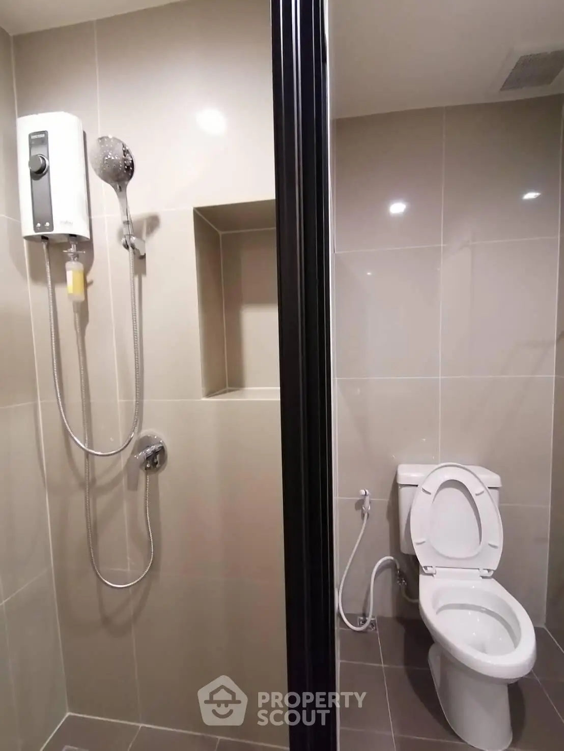 Modern bathroom with shower and toilet in sleek design