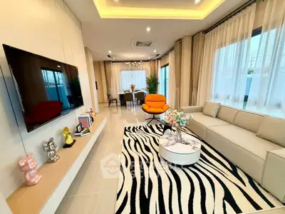 Modern living room with stylish decor and open dining area