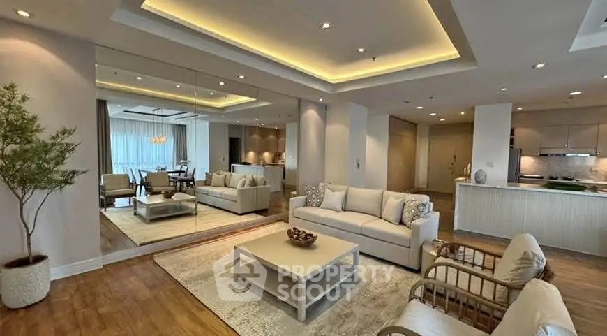 Luxurious modern living room with elegant lighting and spacious open layout.