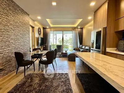 Modern open-plan living room with stylish decor and large windows.