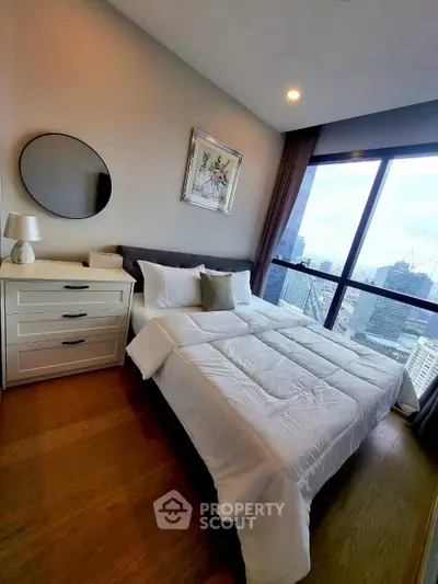 Luxurious bedroom with stunning city view and elegant decor