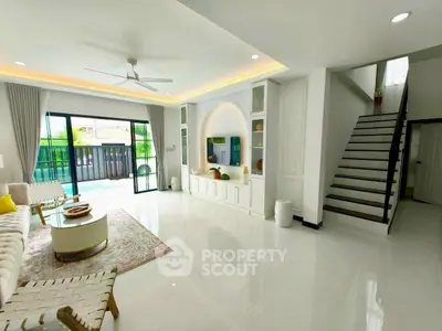 Spacious modern living room with pool view and elegant decor