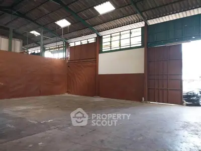 Spacious industrial warehouse with high ceilings and large open floor plan.