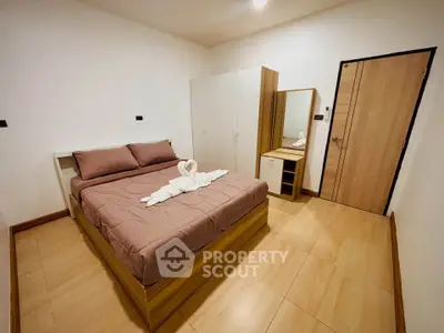 Cozy bedroom with modern furniture and elegant decor, perfect for relaxation and comfort.