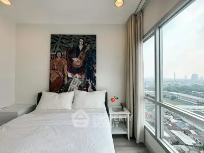 Modern bedroom with large window offering stunning city view, featuring stylish decor and cozy ambiance.
