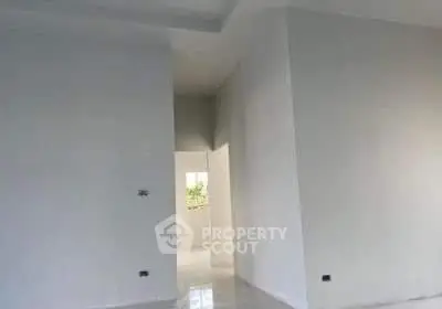 Spacious minimalist interior with high ceilings and natural light